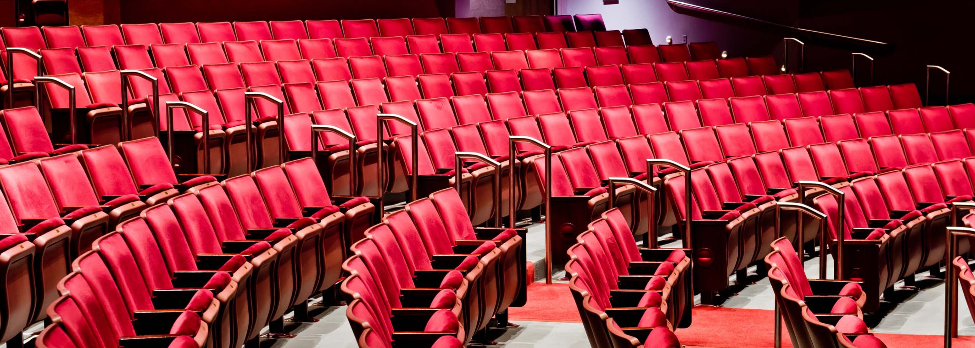 red seats in a theater.