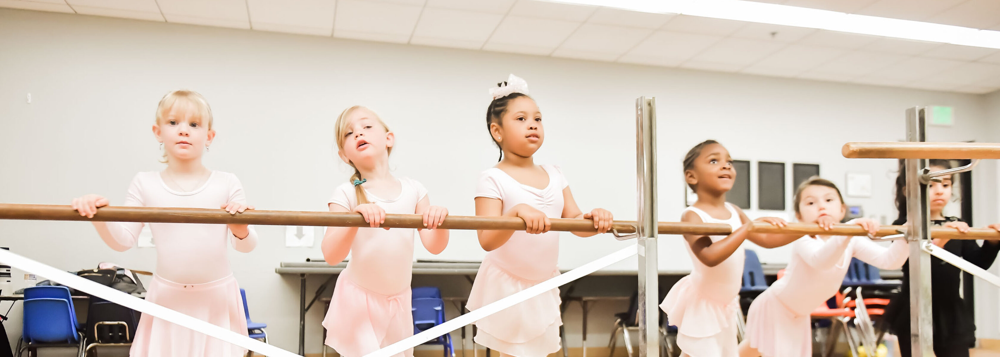 young ballerinas on barre in class.