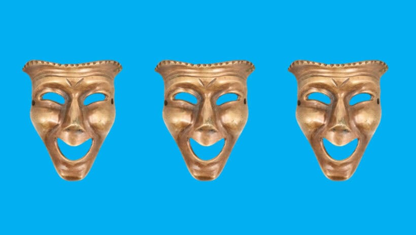 three masks of comedy on blue background